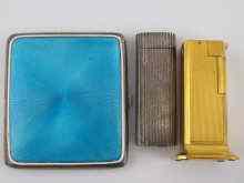 Appraisal: A Dunhill table lighter and a silver plated Cartier lighter