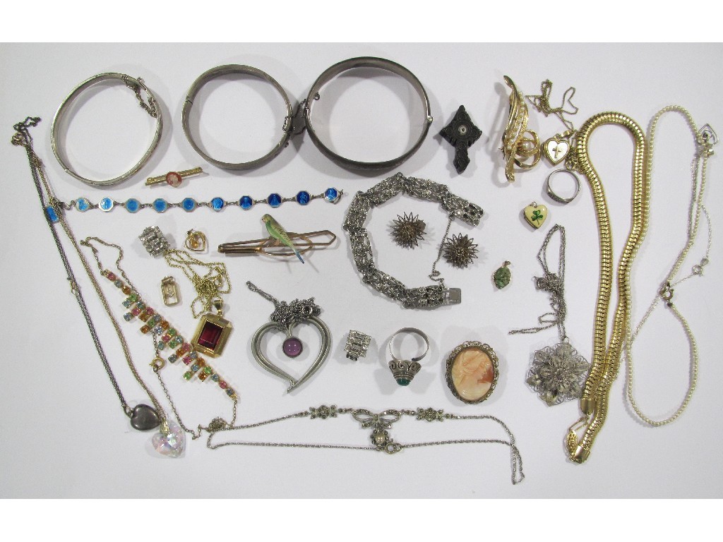 Appraisal: Lot comprising three silver bangles costume brooches and necklaces cameo