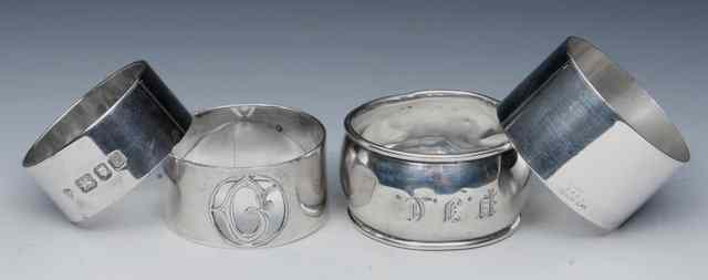 Appraisal: A SILVER NAPKIN RING with the pierced initial 'G' two