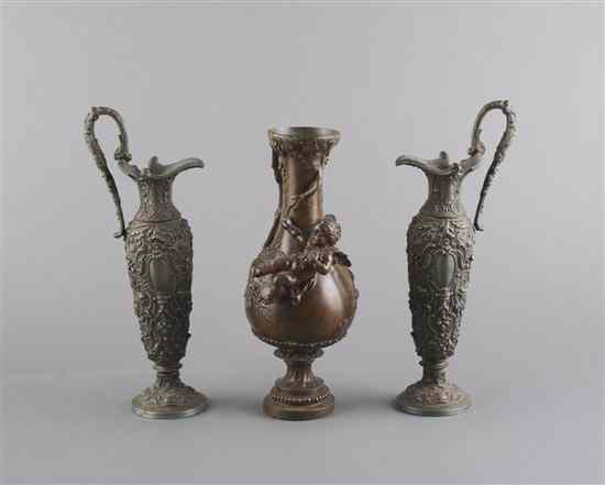 Appraisal: A Pair of Neoclassical Style Spelter Ewers together with another