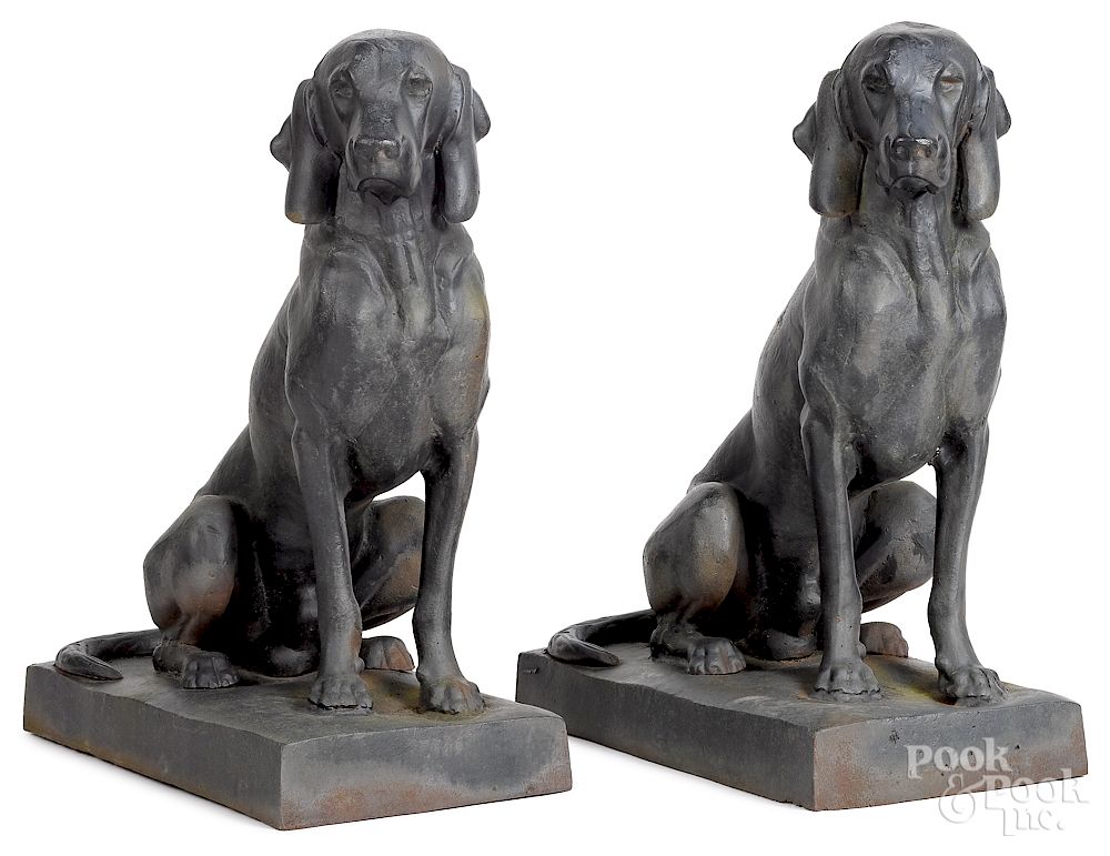 Appraisal: Pair of cast iron garden figures of seated hounds Exclusive