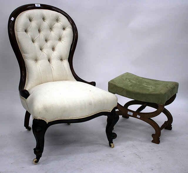 Appraisal: A VICTORIAN BUTTON UPHOLSTERED NURSING CHAIR with cabriole legs cm