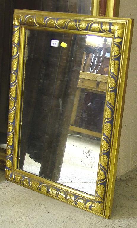 Appraisal: Carved rectangular gilt wood wall mirror decorated with a trail