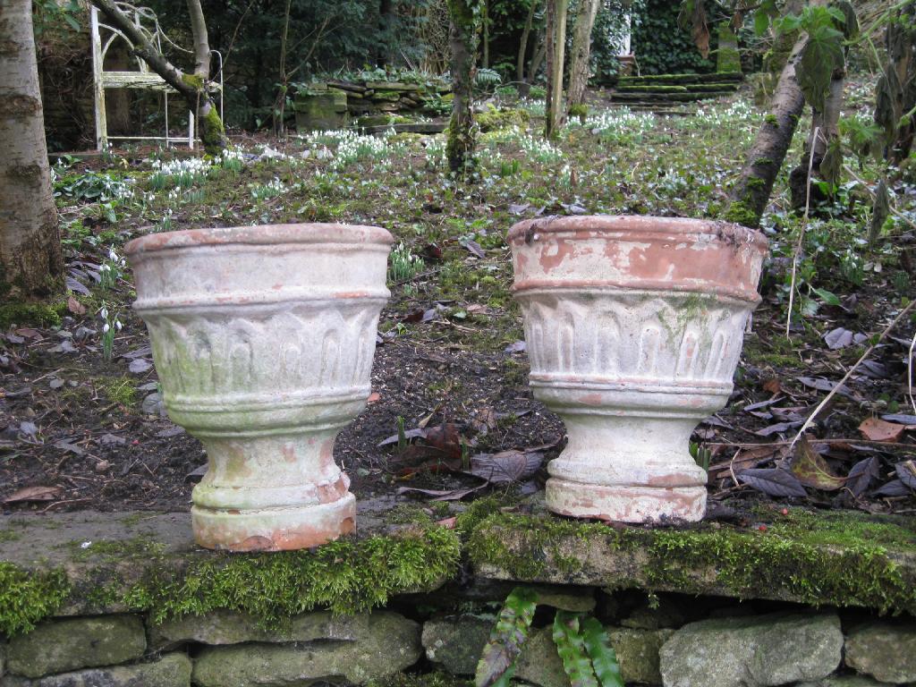 Appraisal: A near pair of th Century Terra Cotta circular Plant