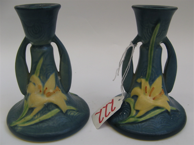 Appraisal: PAIR AMERICAN ROSEVILLE ART POTTERY CANDLESTICKS in the Zephyr Lily