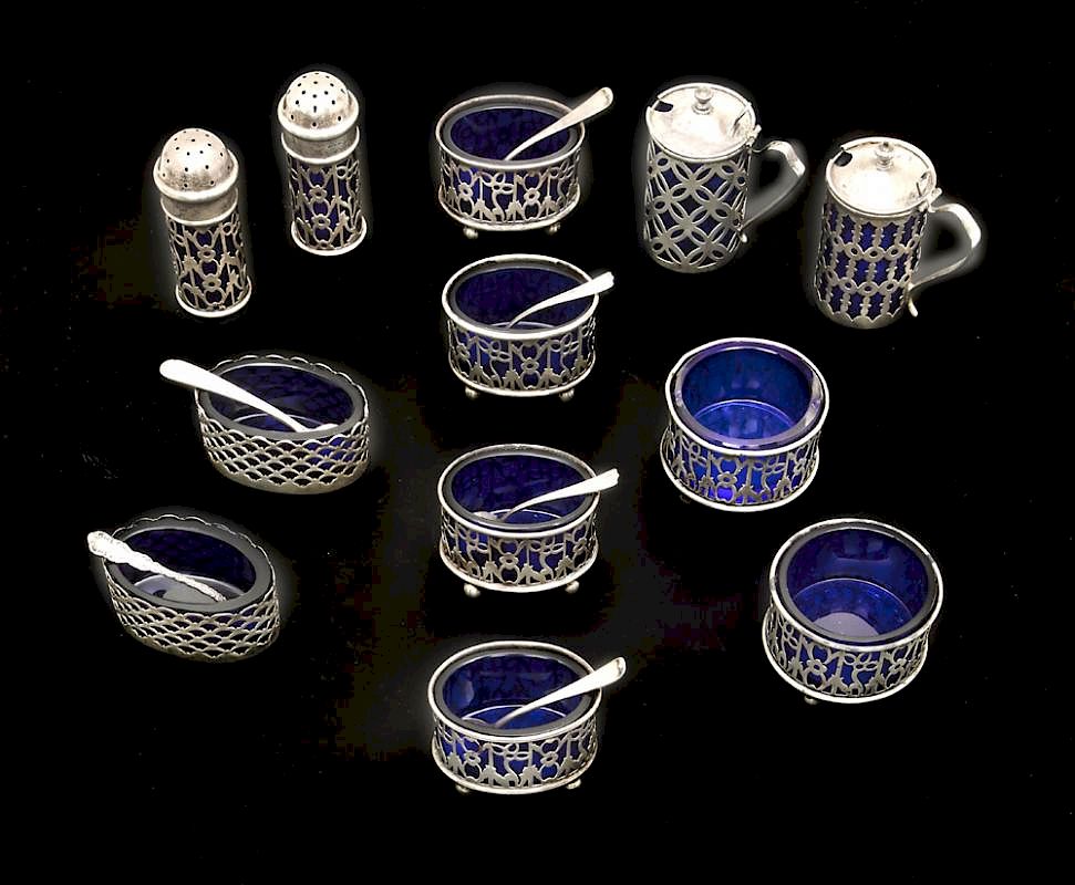 Appraisal: Sterling and cobalt glass salt cellars and pepper shakers Sterling