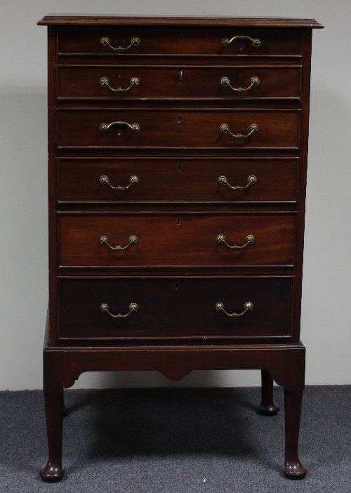 Appraisal: A mahogany collector's cabinet of six drawers on cabriole legs