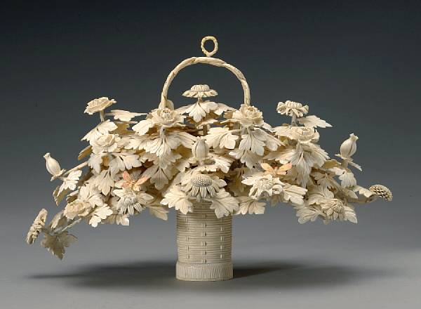 Appraisal: A pieced and tinted ivory basket of flowers th Century