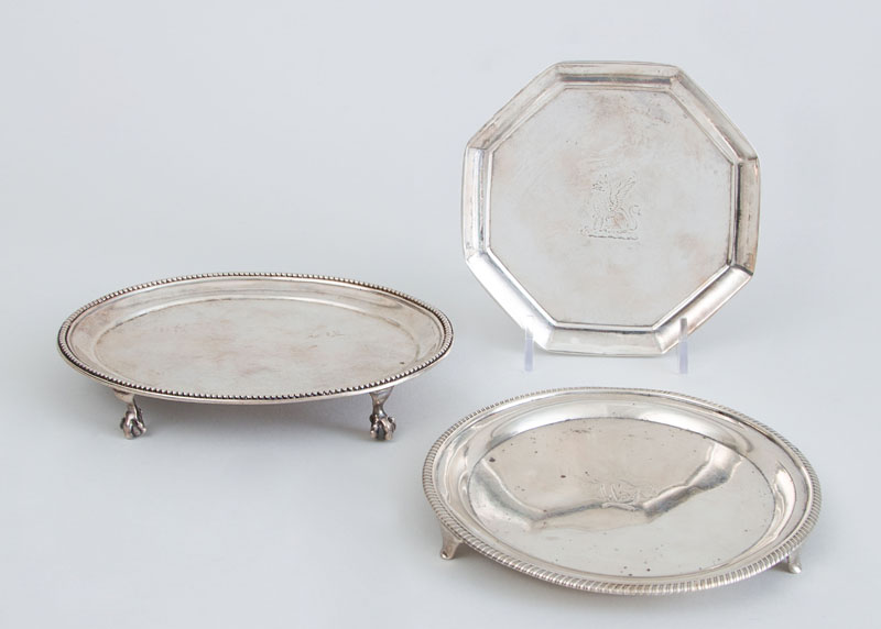 Appraisal: TWO GEORGE III SILVER TEAPOT STANDS AND A GEORGE III