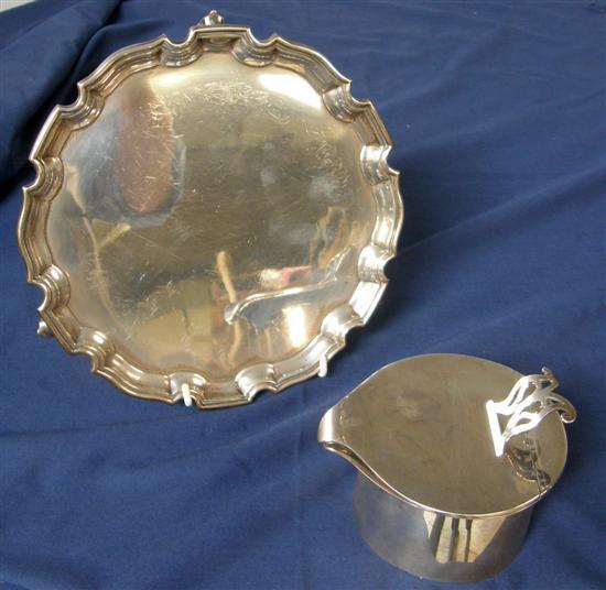 Appraisal: George V silver shaped circular waiter on three scroll Chester