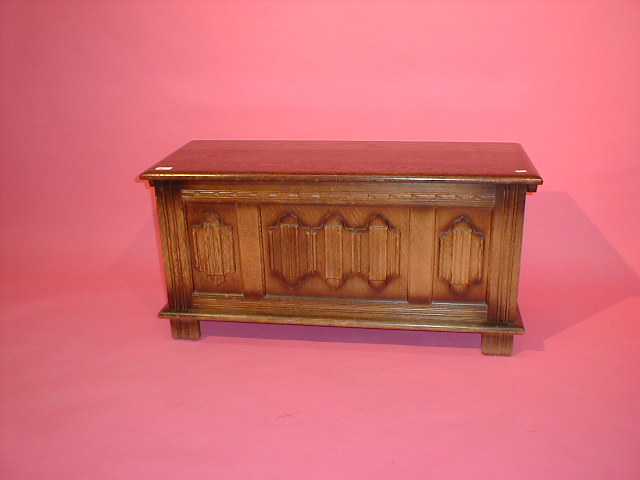 Appraisal: A linen fold oak reproduction coffer