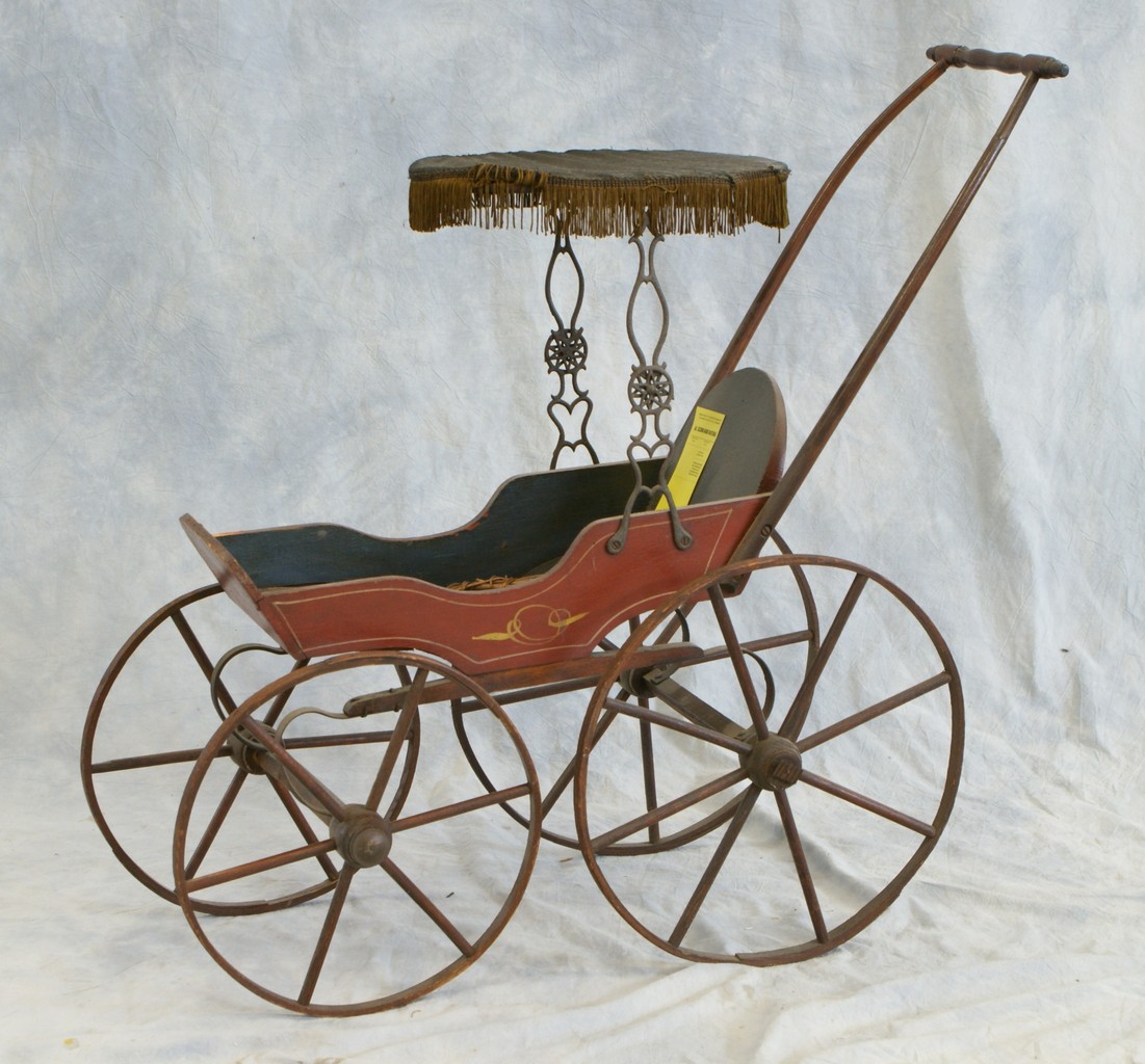 Appraisal: Wood doll carriage with canopy and painted decoration high x