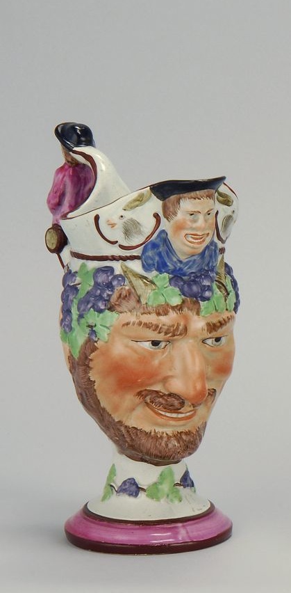 Appraisal: UNUSUAL STAFFORDSHIRE BACCHUS JUG Circa With colorful grape motif Figure