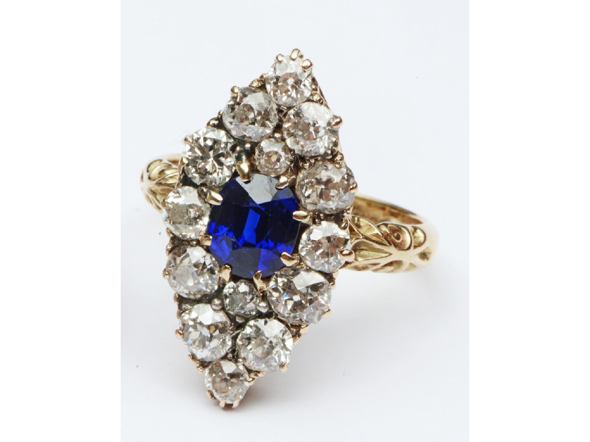 Appraisal: A sapphire and diamond ring the navette-shaped motif centred with