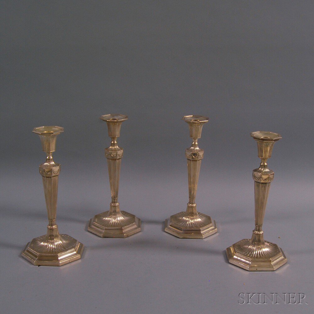 Appraisal: Set of Four Barker Brothers Classical Revival Silver-plated Candlesticks Birmingham