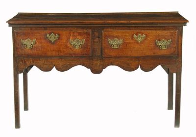 Appraisal: An th century small oak dresser the boarded top above