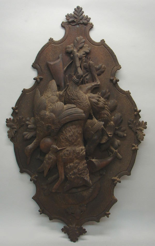 Appraisal: Carved plaque features hunt motif with fox duck rifle foliage