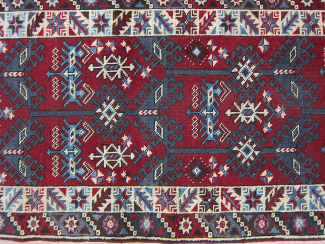 Appraisal: ANATOLIAN CAUCASIAN RUNNER hand knotted in an overall geometric pattern