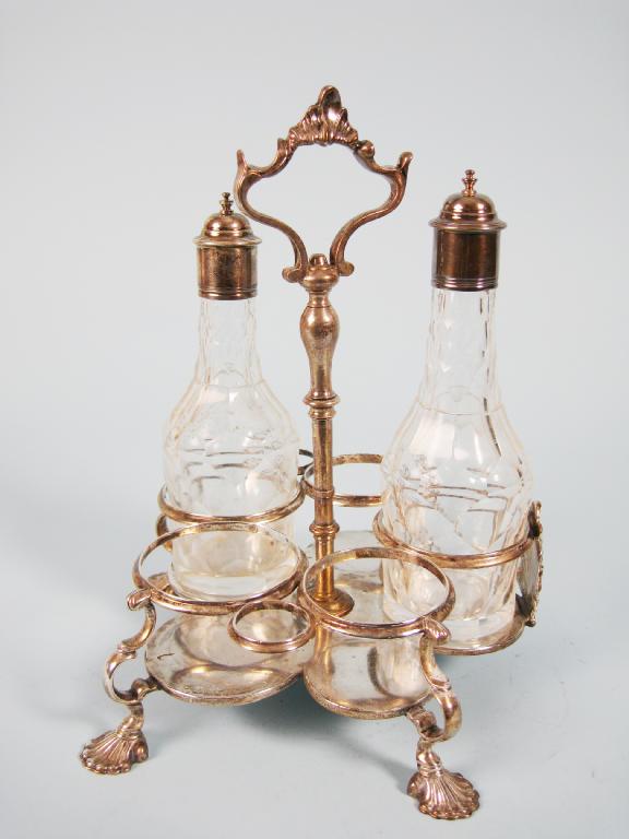 Appraisal: A George III Warwick style five bottle Cruet with central