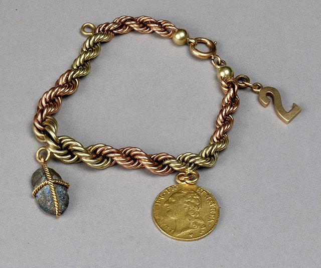 Appraisal: A TWO COLOUR GOLD ROPE CHAIN BRACELET with two attached