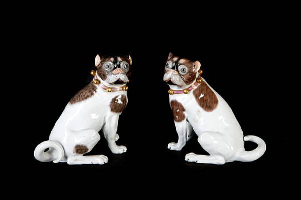 Appraisal: A pair of Dresden porcelain models of pugs retailed by