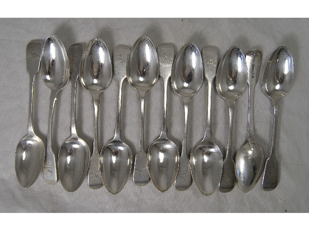 Appraisal: Twelve silver fiddle pattern dessert spoons all bearing crest of