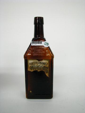 Appraisal: Antique bitters bottle Holzermann's Stomach Bitters log cabin style partial