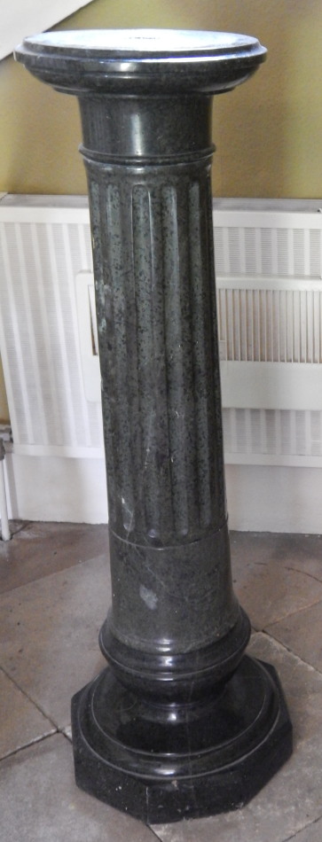 Appraisal: A thC green marble pedestal with a circular top and