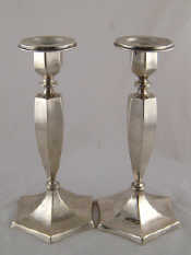 Appraisal: A pair of continental white metal tests silver candle sticks