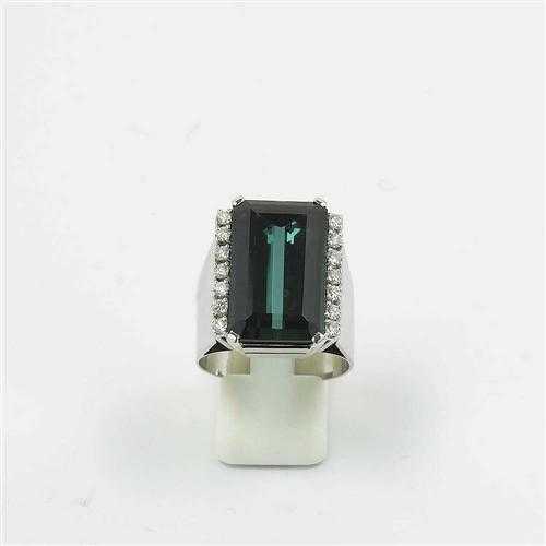 Appraisal: TOURMALINE AND BRILLIANT-CUT DIAMOND RING White gold Decorative broad ring