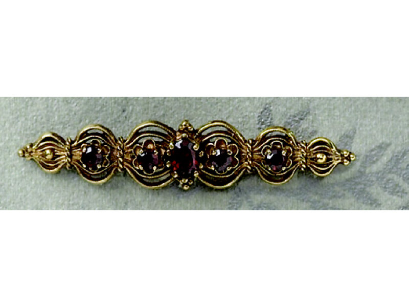 Appraisal: GARNET BAR PIN k yellow gold ornate brooch with one