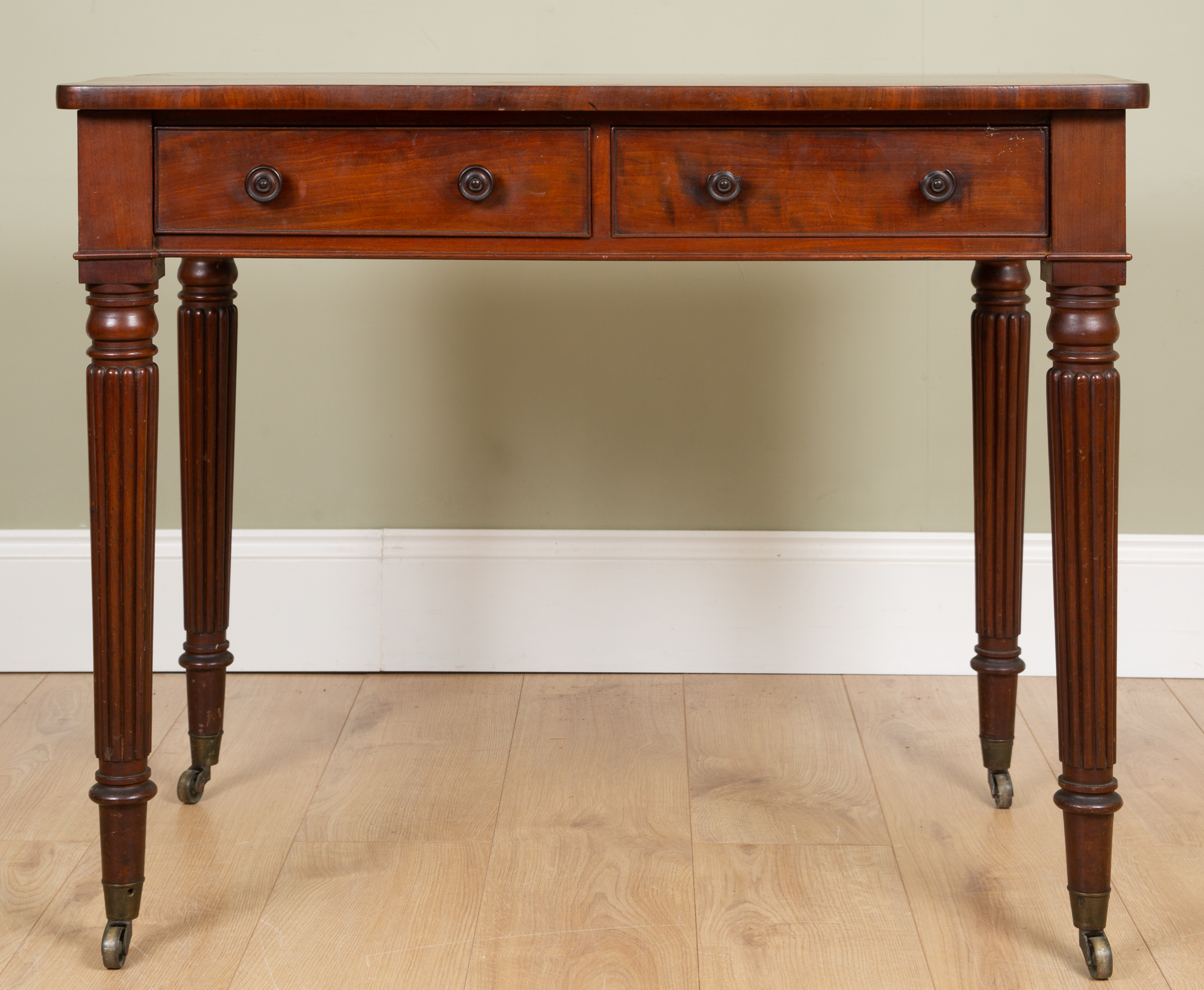 Appraisal: A George III mahogany side table with twin frieze drawers