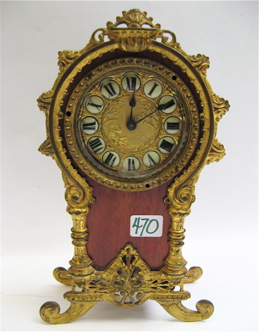 Appraisal: MAHOGANY CASED MANTLE CLOCK spring wound accented with gilt metal