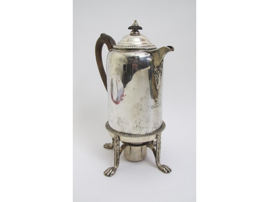 Appraisal: An Irish silver hot water pot on stand with burner