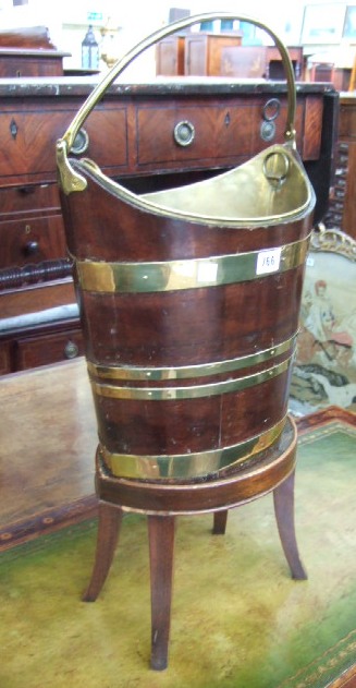 Appraisal: A George III mahogany and brass bound peat bucket circa