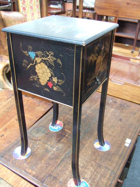 Appraisal: A black lacquer and chinoiserie decorated sewing box with lift