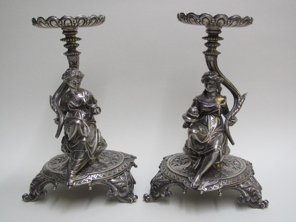 Appraisal: A pair of Elkington silver table lamps cast with symbolic