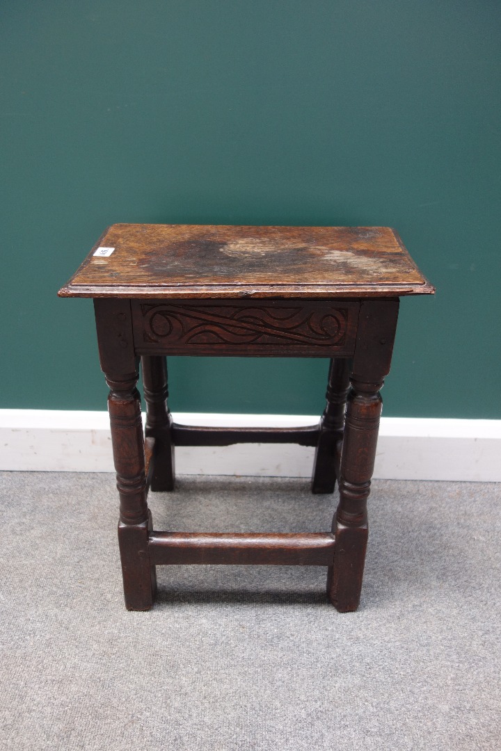 Appraisal: A Charles I oak joint stool with punched carved frieze