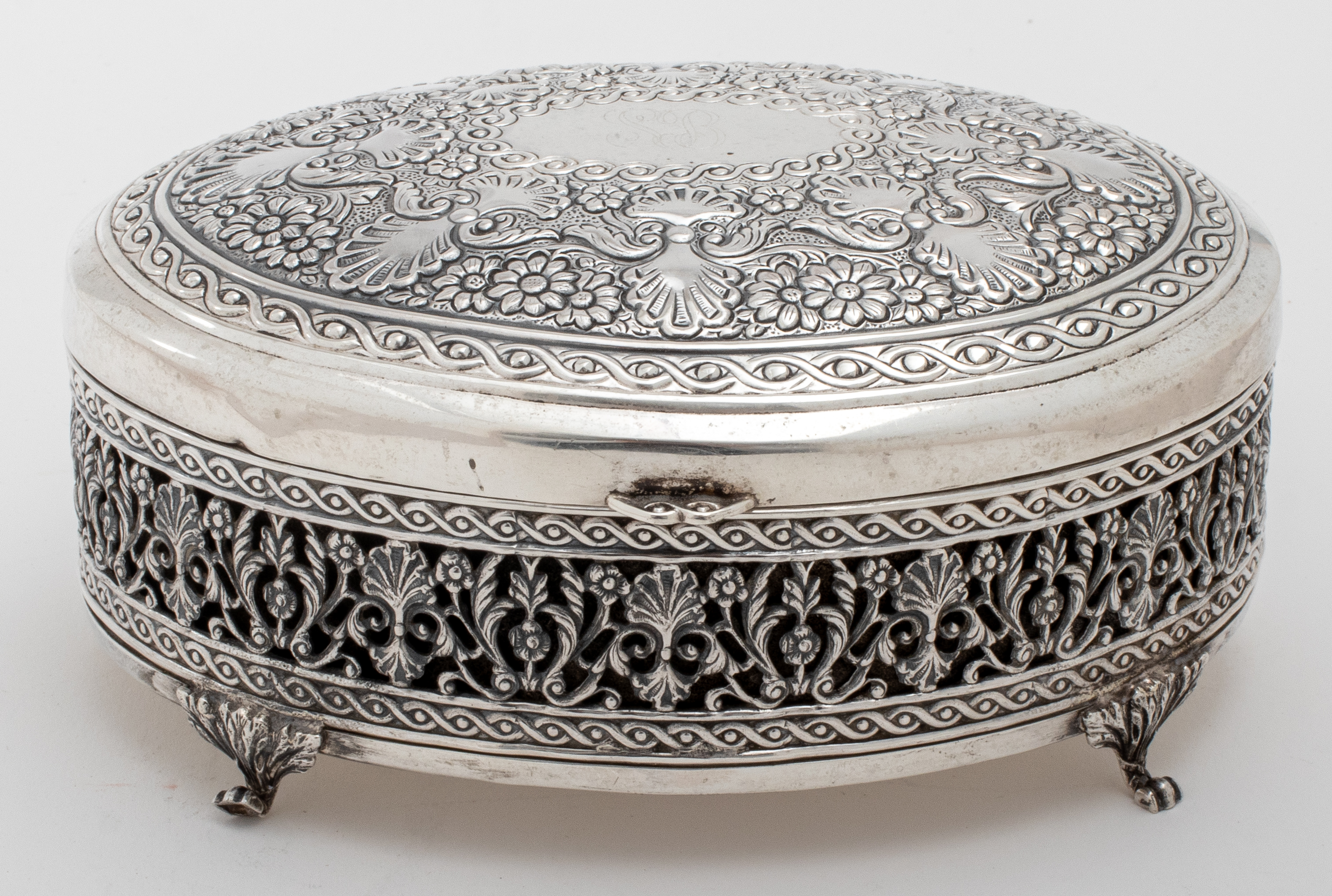 Appraisal: MONOGRAMMED SILVER OVOID FLORAL TRINKET BOX Antique hinged silver trinket