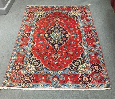 Appraisal: A Hamadan rug the red ground with central medallion and