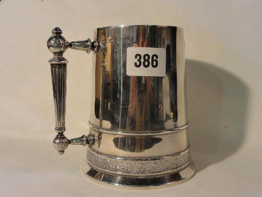 Appraisal: A silver tankard of tapering cylindrical form with stylised handle