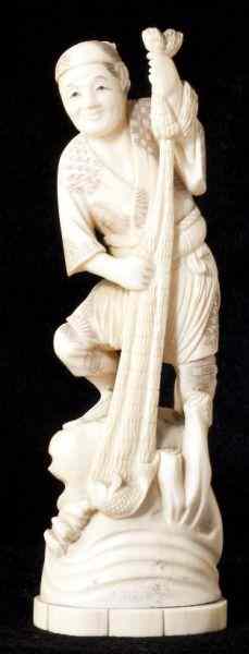 Appraisal: Japanese Ivory Okimono of a FishermanMeiji Period two-part form figure