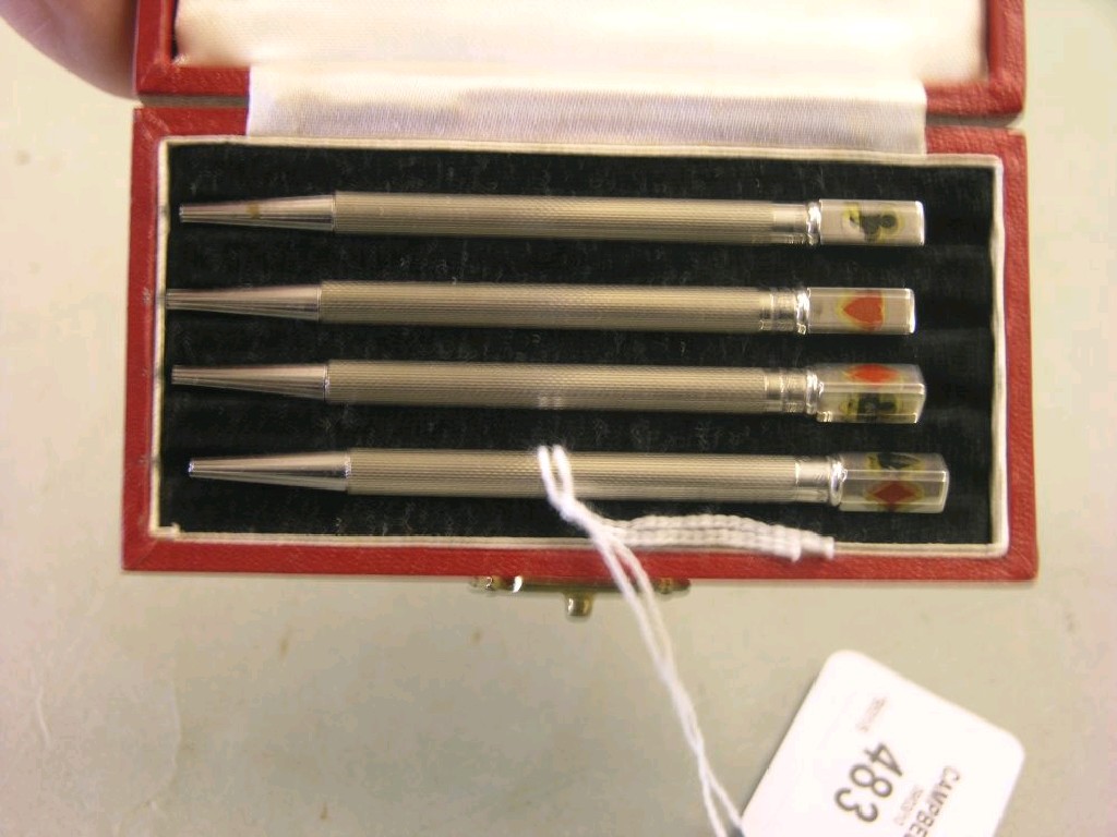 Appraisal: A cased set of four Sterling silver bridge pencils with