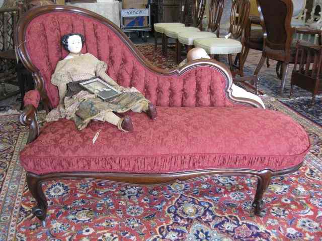 Appraisal: Victorian Chaise Sofa carved mahogany red silk brocade tufted back