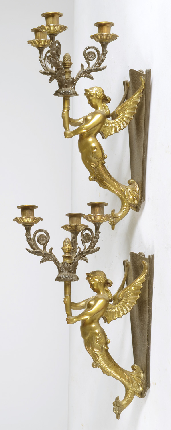 Appraisal: PAIR OF THREE-SOCLE GILT-METAL SCONCES with winged-female design Lengths ConditionUndamaged