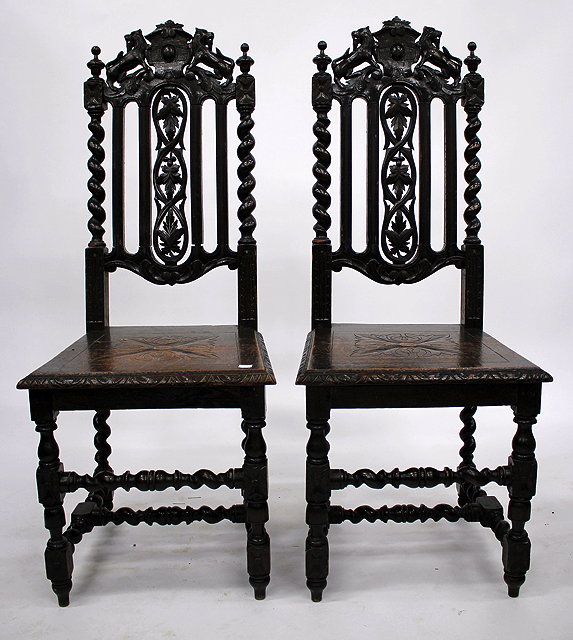 Appraisal: A PAIR OF CAROLEAN STYLE OAK SIDE CHAIRS each with