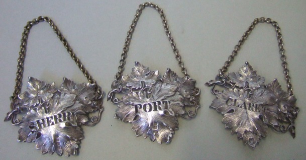 Appraisal: Two Victorian silver decanter labels each designed as a vine