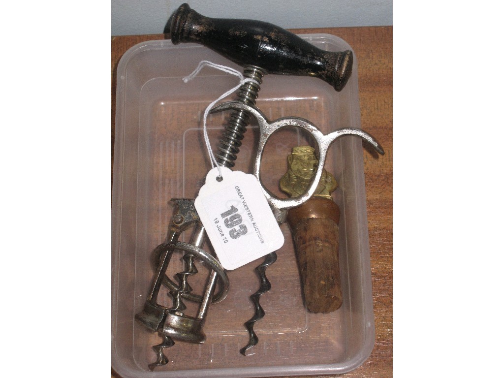 Appraisal: Lot comprising two old corkscrews and a bottle stopper