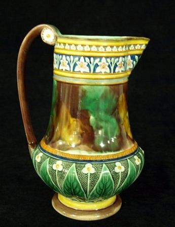 Appraisal: A Wedgwood majolica jug of baluster form with flowerhead decoration