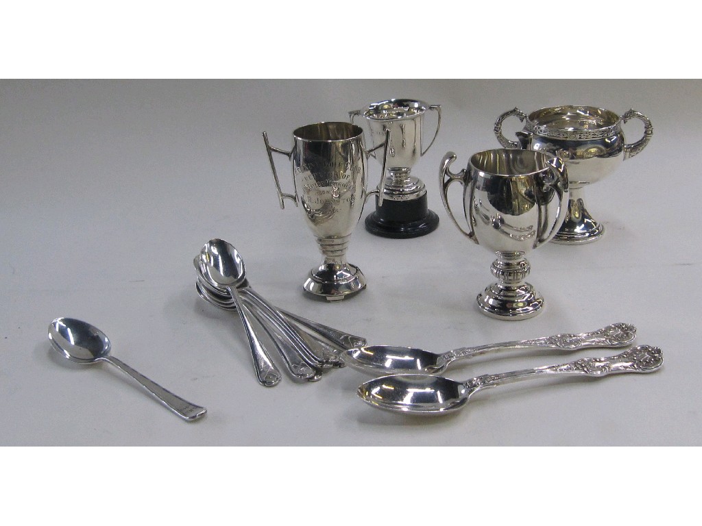 Appraisal: Lot comprising four silver trophy cups and assorted silver spoons